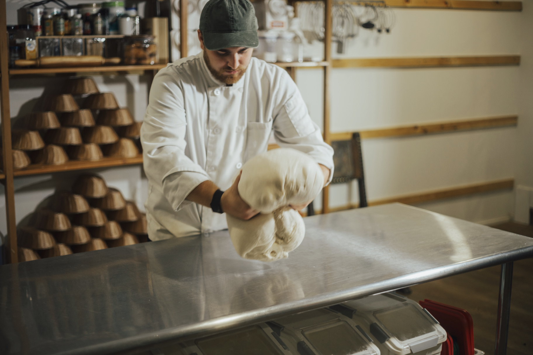 Hands shaping dough
